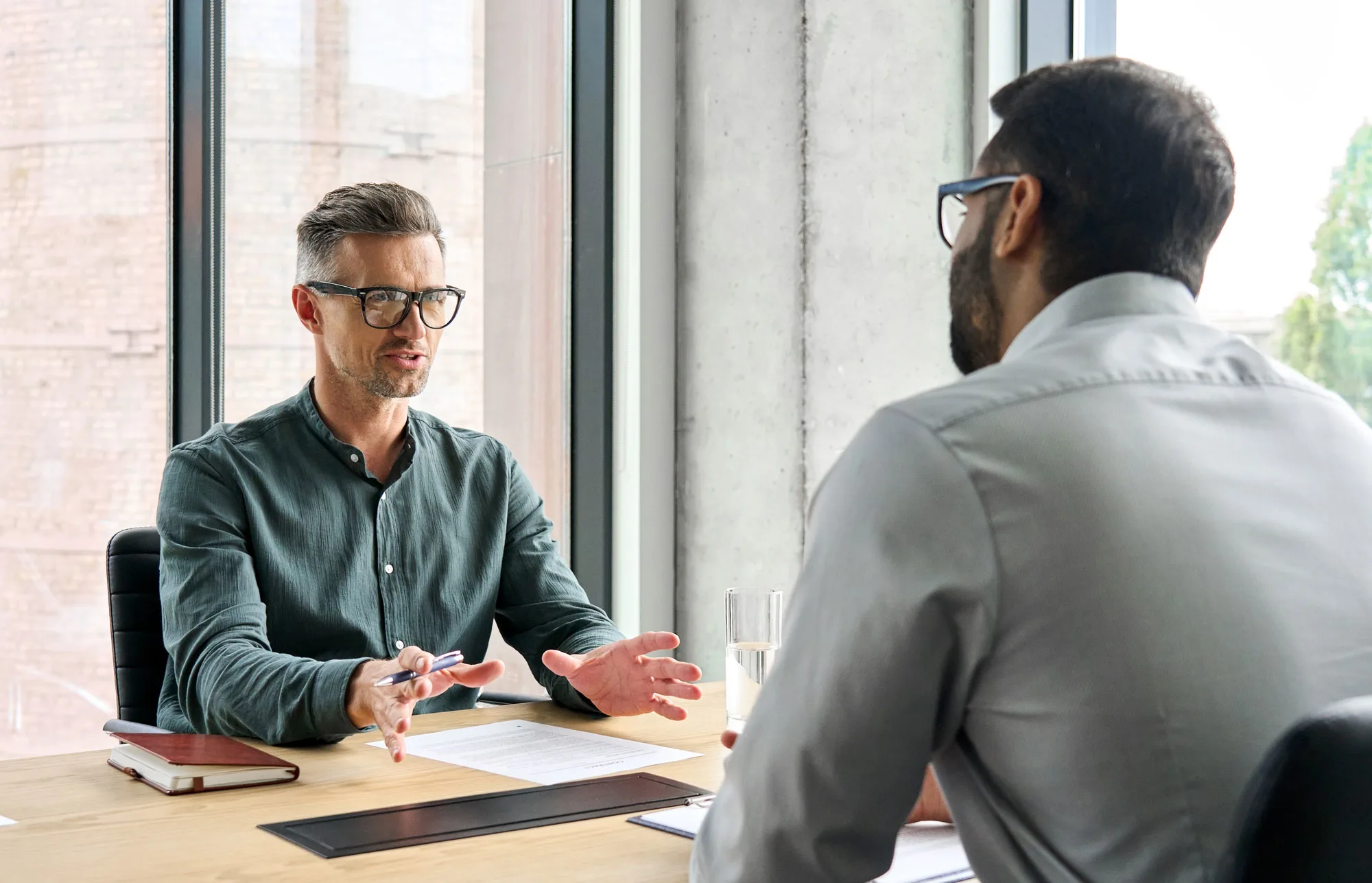 Consultant discussing hiring and HR operations needs with a client